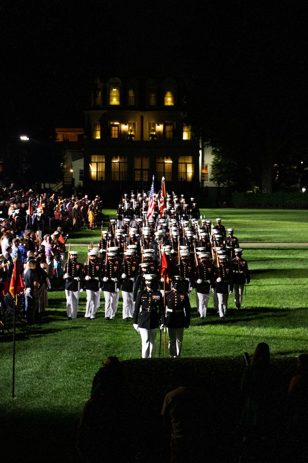 Marines with Marine Barracks Washington conduct “pass in review” during the Friday Evening Parade at MBW, Aug. 20, 2021. The guest of honor for the evening was Mr. Robert J. Conte III, Chief of the Metropolitan Police Department, and the hosting official was Lt. Gen. David A. Ottignon, Deputy Commandant for Manpower and Reserve. (U.S. Marine Corps photo by Lance Cpl. Allen T. Sanders)