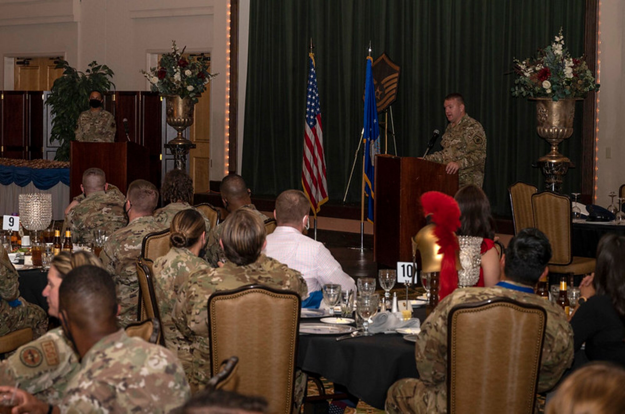 Chief speaks to attendees at banquet.