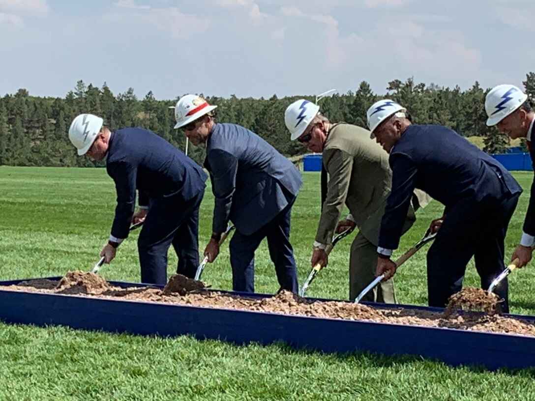 Peter Sturdivant (second from left) Chief, military construction, USACE, Omaha District participates in the groundbreaking ceremony, August 6.