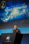 Army general speaks during Space Symposium.