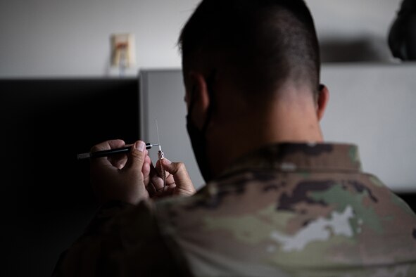 PETERSON SPACE FORCE BASE, Colo. - U.S. Air Force Col. David Wilson, 21st Mission Support Group commander, splices fiber cables while on his one-day deployment with the 21st Communication Squadron at Peterson Space Force Base, Colorado, Aug. 20, 2021.  The 21st CS mission is to operate global missile warning systems and deliver cyberspace capabilities to defend the homeland and achieve U.S. and allied warfighter objectives. (U.S. Space Force photo by Airman 1st Class Joshua Fontenot)