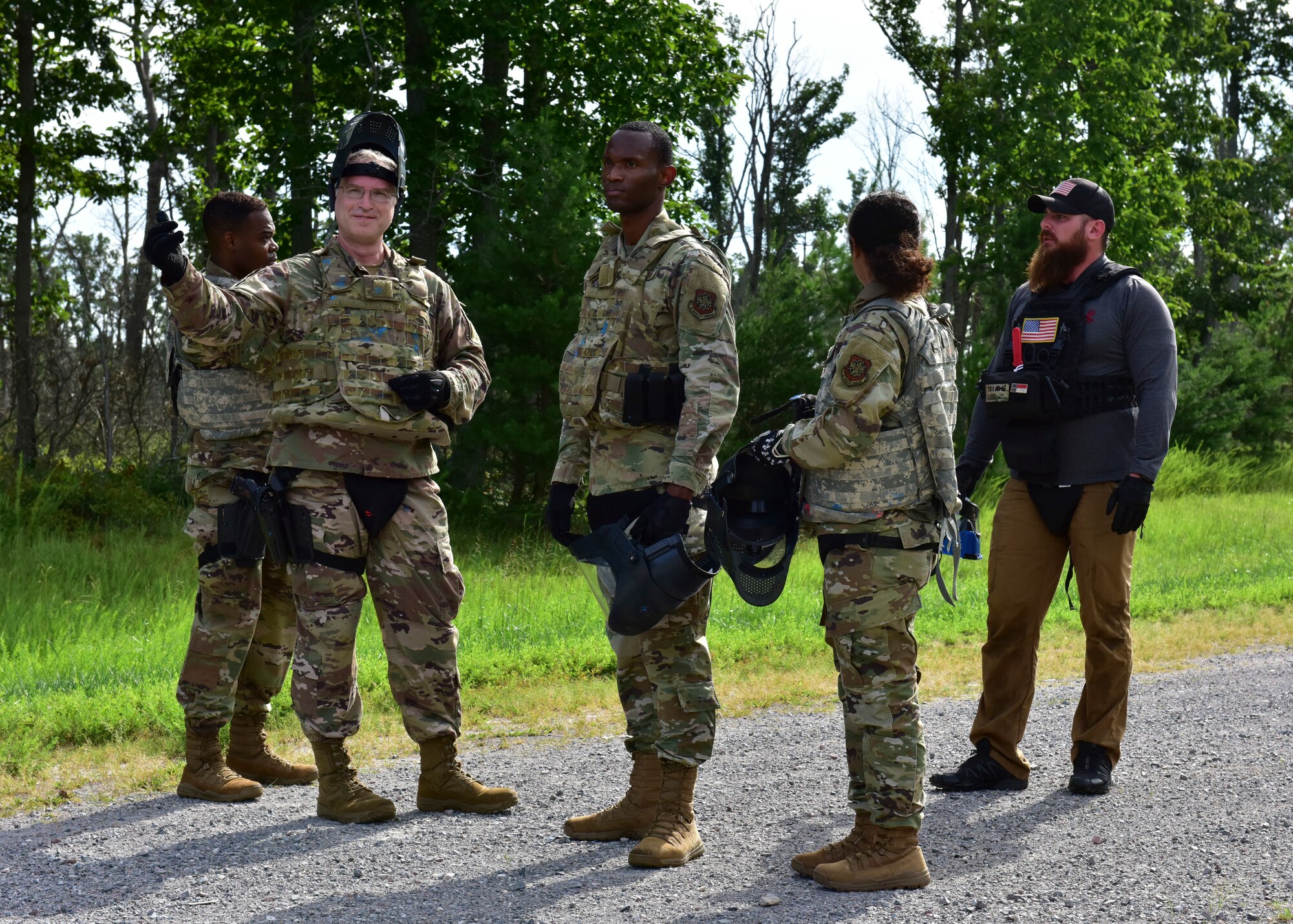 Judge Advocate Airmen from Joint Base McGuire-Dix-Lakehurst, New Jersey, speak with an instructor from the 421st Combat Training Squadron during the Fieldcraft Judge Advocate Course Aug. 19, 2021. The training helps JA Airmen receive general and theater-specific operations training to provide legal skills and theater awareness needed to operate in today’s contingency environments. (U.S. Air Force photo by Staff Sgt. Jake Carter)