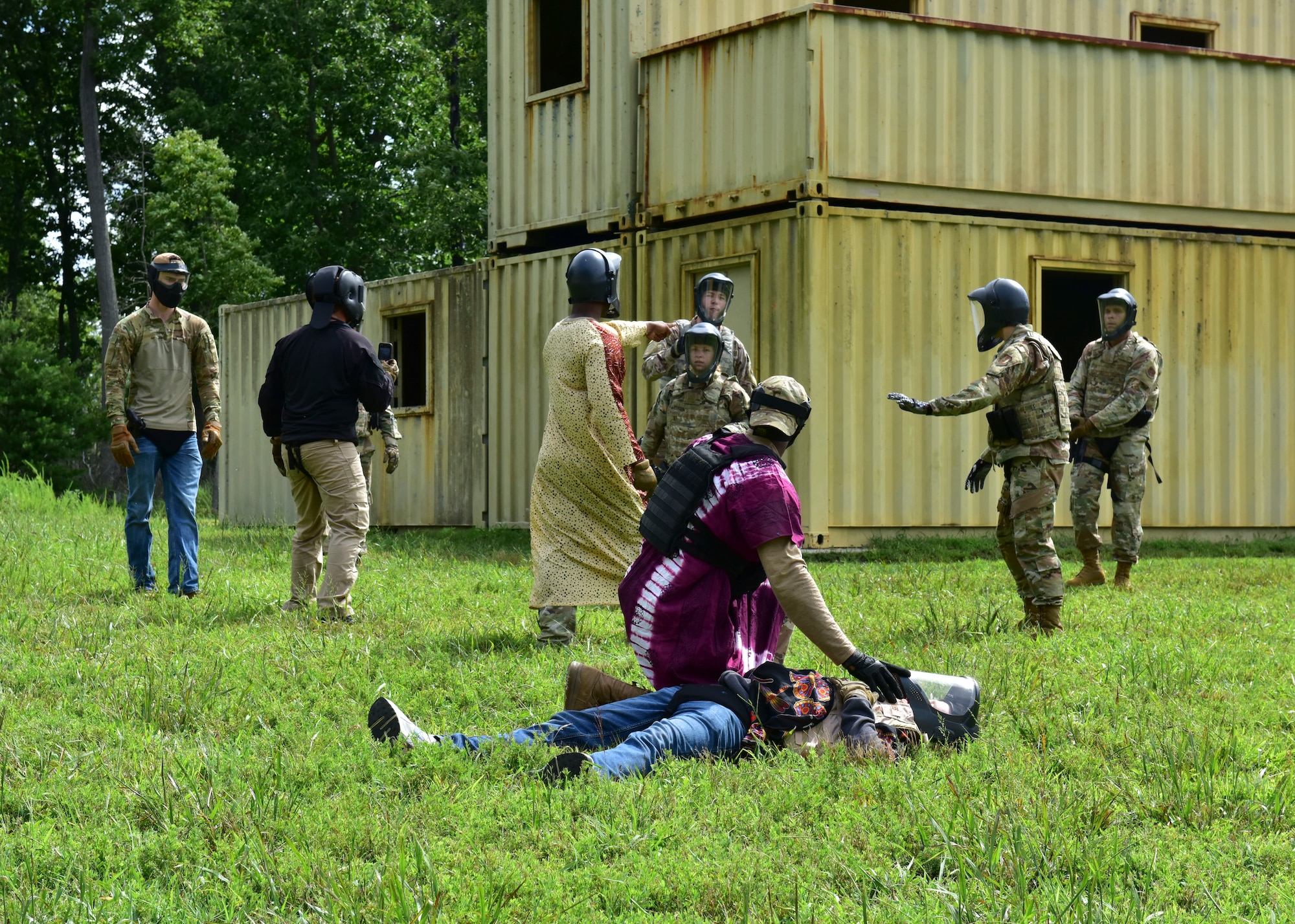 Instructors from the 421st Combat Training Squadron and Judge Advocate Airmen from Joint Base McGuire-Dix-Lakehurst, New Jersey, simulate a hostile scenario during the Fieldcraft Judge Advocate Course, Aug. 19, 2021. Trainees received scenario based escalation of force training, weapons familiarization, Islamic and host nation cultural training and sister service customs. (U.S. Air Force photo by Staff Sgt. Jake Carter)