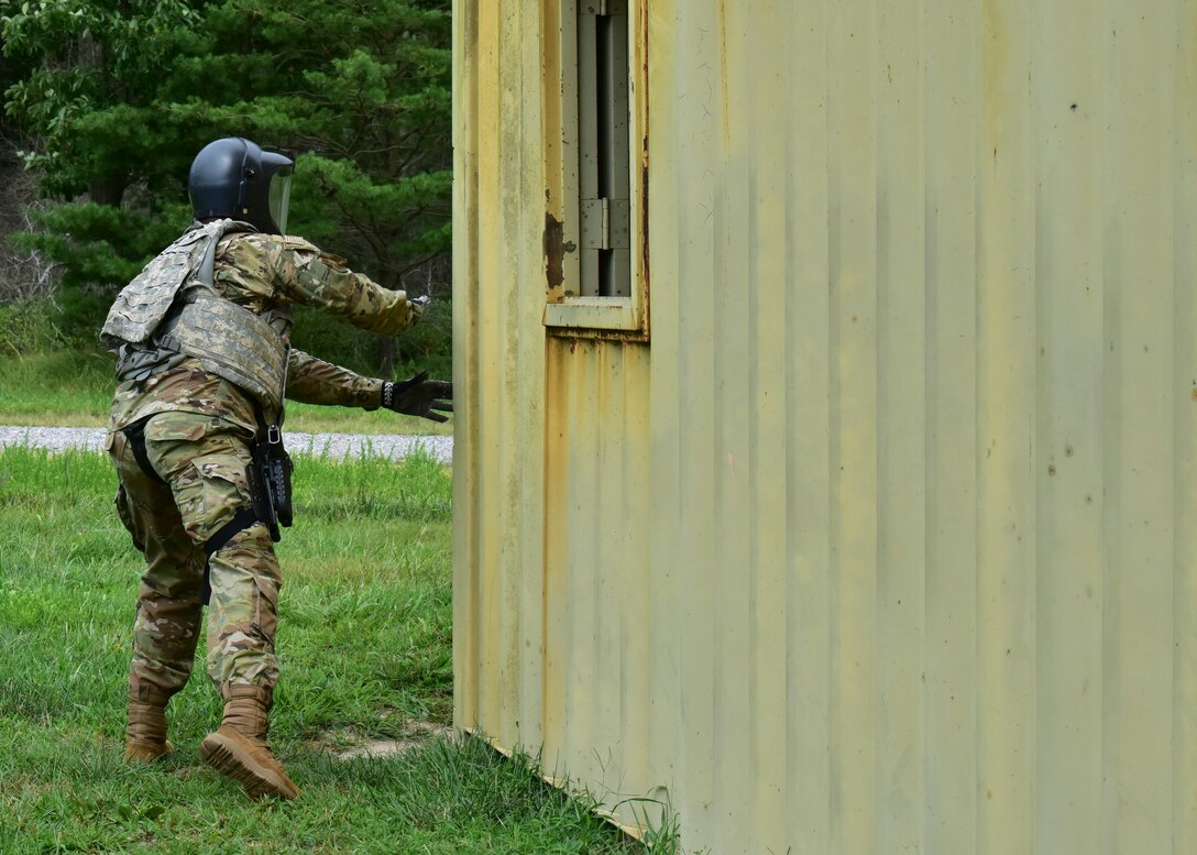 A Judge Advocate Airman from Joint Base McGuire-Dix-Lakehurst, New Jersey, uses cover to evade 421st Combat Training Squadron instructors acting as opposition forces during the Fieldcraft Judge Advocate Course, Aug. 19, 2021. During the course, students receive training on subjects including general and theater-specific operations law, Islamic Culture, sister service customs, counter insurgency concepts, supplementary contingency skills field training including advanced tactics, additional weapons familiarization, and judgment-based Escalation of Force training. (U.S. Air Force photo by Staff Sgt. Jake Carter)