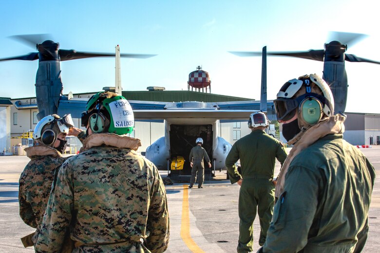United States Marines with 2nd Marine Aircraft Wing, II Marine Expeditionary Force, prepare to board MV-22B Ospreys to deploy to Haiti in support of Joint Task Force-Haiti for a humanitarian-assistance and disaster-relief mission from Marine Corps Air Station New River, North Carolina, Aug. 23, 2021. (U.S. Marine Corps photo by Lance Cpl. Eric Ramirez)