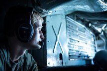 Capt. Brian Seilhammer, 96th Bomb Squadron instructor pilot, communicates with aircrew members during a readiness exercise after departing Barksdale Air Force Base, Louisiana, Aug. 18, 2021.