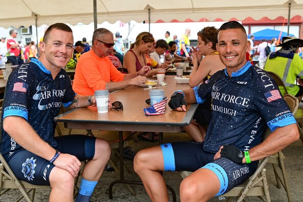U.S. Space Force Capt. Nicholas Ruiz (right), Space Delta 9 – Orbital Warfare, 1st Space Operations Squadron director of assessments, exercises and analysis, and U.S. Space Force Tech. Sgt. Kristopher Rowell (left), DEL 9, 1st SOPS future operations section chief, take a break on day six of the Air Force Cycling Team's trip through Iowa, July 30, 2021. Register’s Annual Great Bicycle Ride Across Iowa, is a seven-day bicycling adventure that tests endurance, showcases community and builds lasting friendships. RAGBRAI is the longest, largest and oldest bicycle touring event in the world and is held in Iowa. AFCT consists of men and women who are serving or who have served, and who exemplify what makes our Air Force what it is today. The team uses cycling as a way to display wingmanship and an attitude of service. The primary mission is to promote the Air Force as our nation’s great defender of freedom in the air, space, and cyberspace. (U.S. Air Force photo by Andrew C. Patterson)