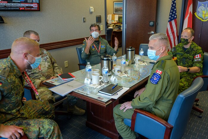 German Air Force  Major-General Karsten Stoye, NATO’s Chief of Staff Allied Air Command (center), met with Royal Canadian Air Force Lieutenant-General Alain Pelletier, Deputy Commander, North American Aerospace Defense Command, and other senior leaders from across NORAD and U.S. Northern Command during his visit to the NORAD and USNORTHCOM headquarters at Peterson Space Force Base, Colorado, Aug. 23, 2021. Stoye traveled to the headquarters to receive information on the Global Information Dominance Experiments and discuss with leadership how NORAD and USNORTHCOM and NATO can collaborate on missile defense.