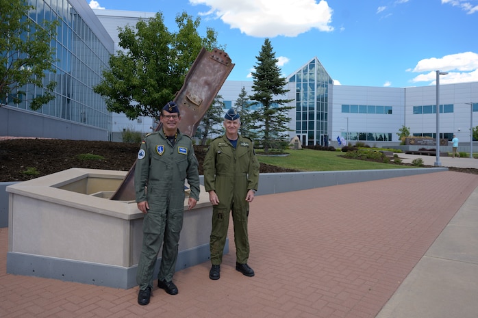 German Air Force Major-General Karsten Stoye, NATO’s Chief of Staff Allied Air Command, stands with Royal Canadian Air Force Major-General Patrick Carpentier, North American Aerospace Defense Command Director of Operations, at the command’s 9/11 Memorial during his visit to the NORAD and U.S. Northern Command Headquarters at Peterson Space Force Base, Colorado, Aug. 23, 2021. Stoye traveled to the headquarters to receive information on the Global Information Dominance Experiments and discuss with leadership how NORAD and USNORTHCOM and NATO can collaborate on missile defense.