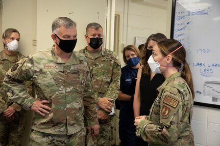 U.S. Air Force Gen. Glen VanHerck, commander of North American Aerospace Defense Command and U.S. Northern Command, receives a briefing from the Task Force Eagle medical support staff during his tour of the facilities being used in support of Operation Allies Refuge, Aug. 3, 2021, at Fort Lee, Virginia.