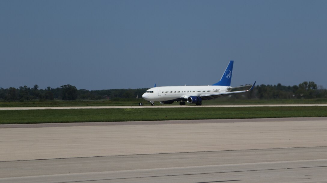 An aircraft transporting vulnerable Afghans lands at Volk Field on Camp Douglas Wisconsin, Aug. 22, 2021.