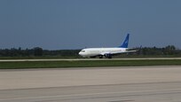 An aircraft transporting vulnerable Afghans lands at Volk Field on Camp Douglas Wisconsin, Aug. 22, 2021.