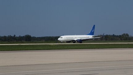 An aircraft transporting vulnerable Afghans lands at Volk Field on Camp Douglas Wisconsin, Aug. 22, 2021.
