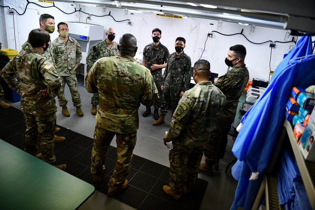 A commander briefs Airmen on COVID.