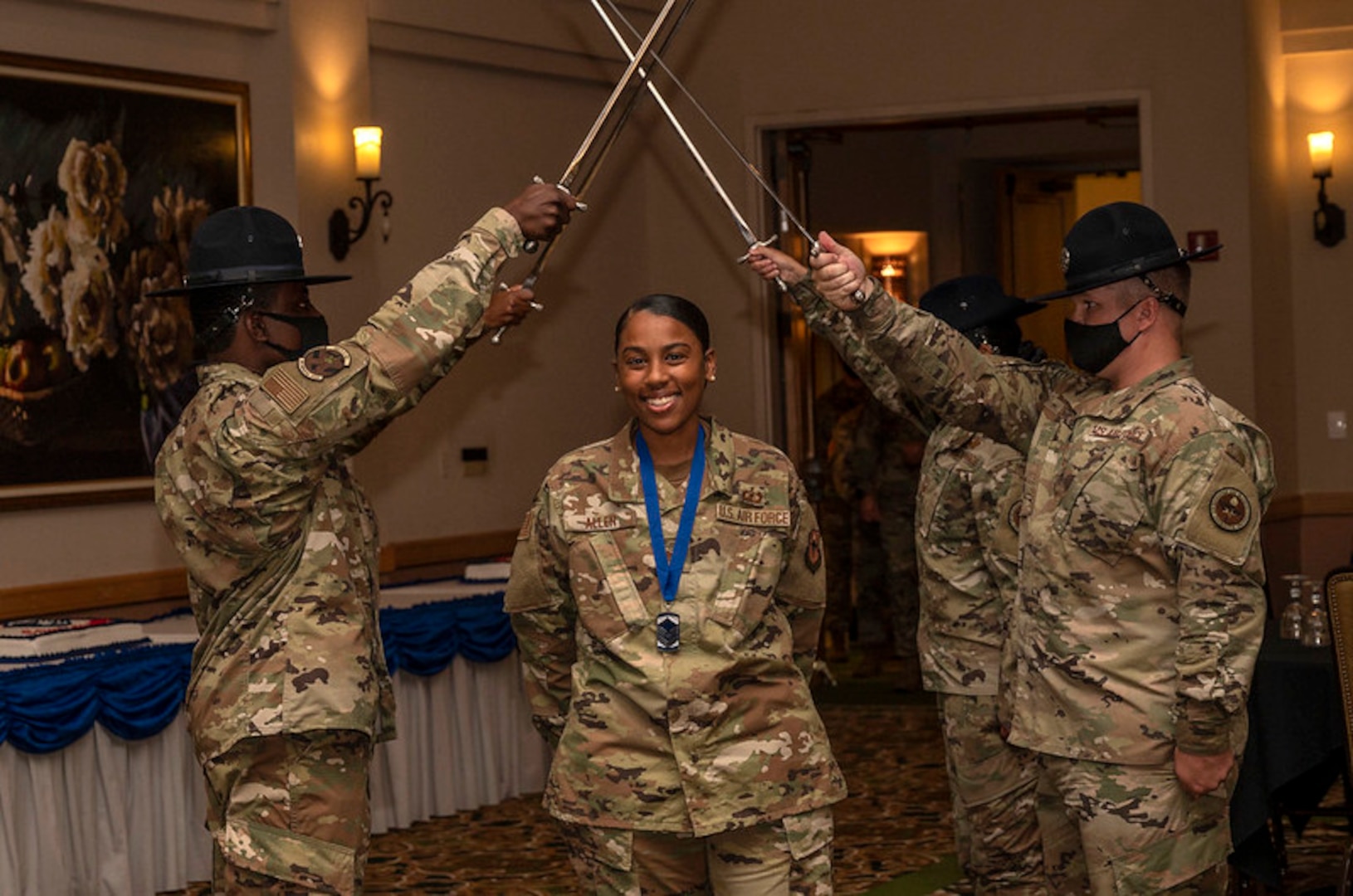 Female NCO passes under saber cordon