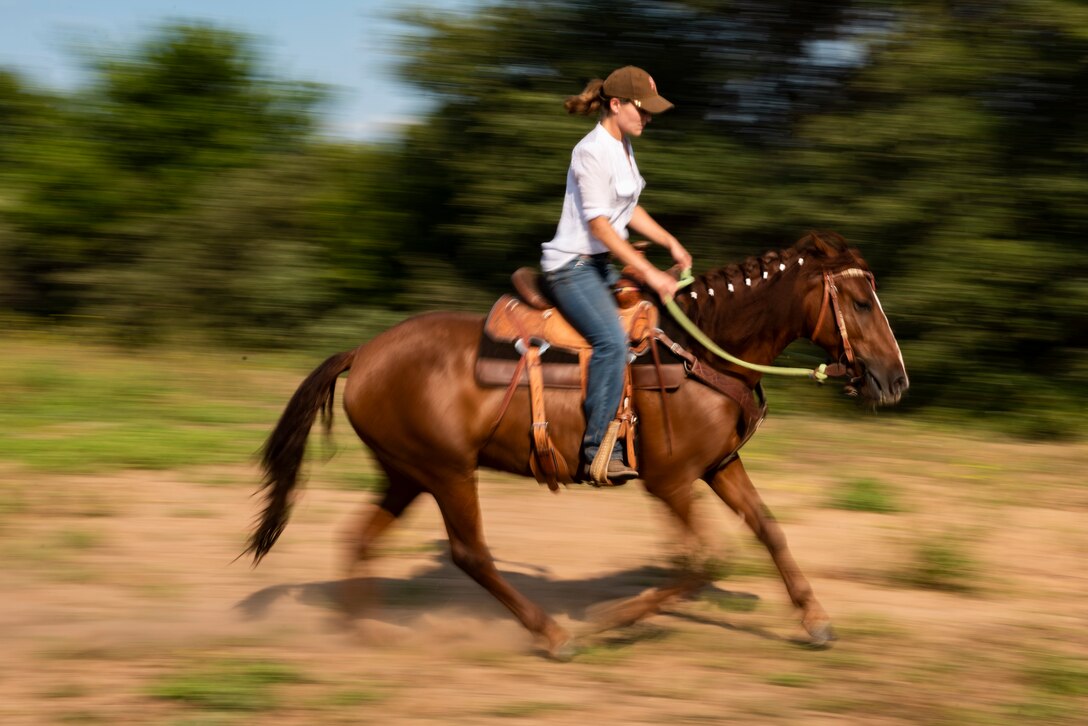 Staff Sgt. Melissa Sekerak, 7th Munitions Squadron stockpile management supervisor, rides her horse, Malibu, in Hawley, Texas, July 20, 2021.