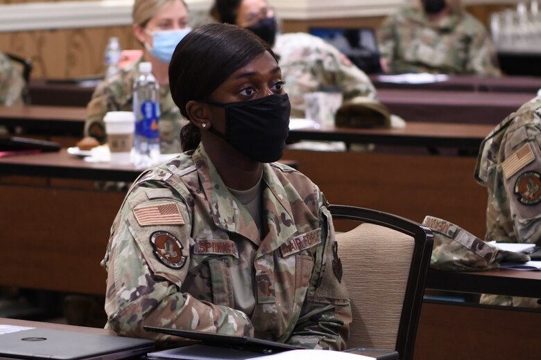 Second Lt. Christyl Springs, a gold bar recruiter from Hill Air Force Base, Utah listens to a presentation during the “Celebrating Sisterhood Through Empowerment, Progress, and Change” Women’s Symposium in San Antonio, Texas, Aug. 10, 2021. The symposium lasted through Aug. 12 and had more than 100 participants from throughout the U.S. representing the Air Force, Air Force Reserve, and Air National Guard.