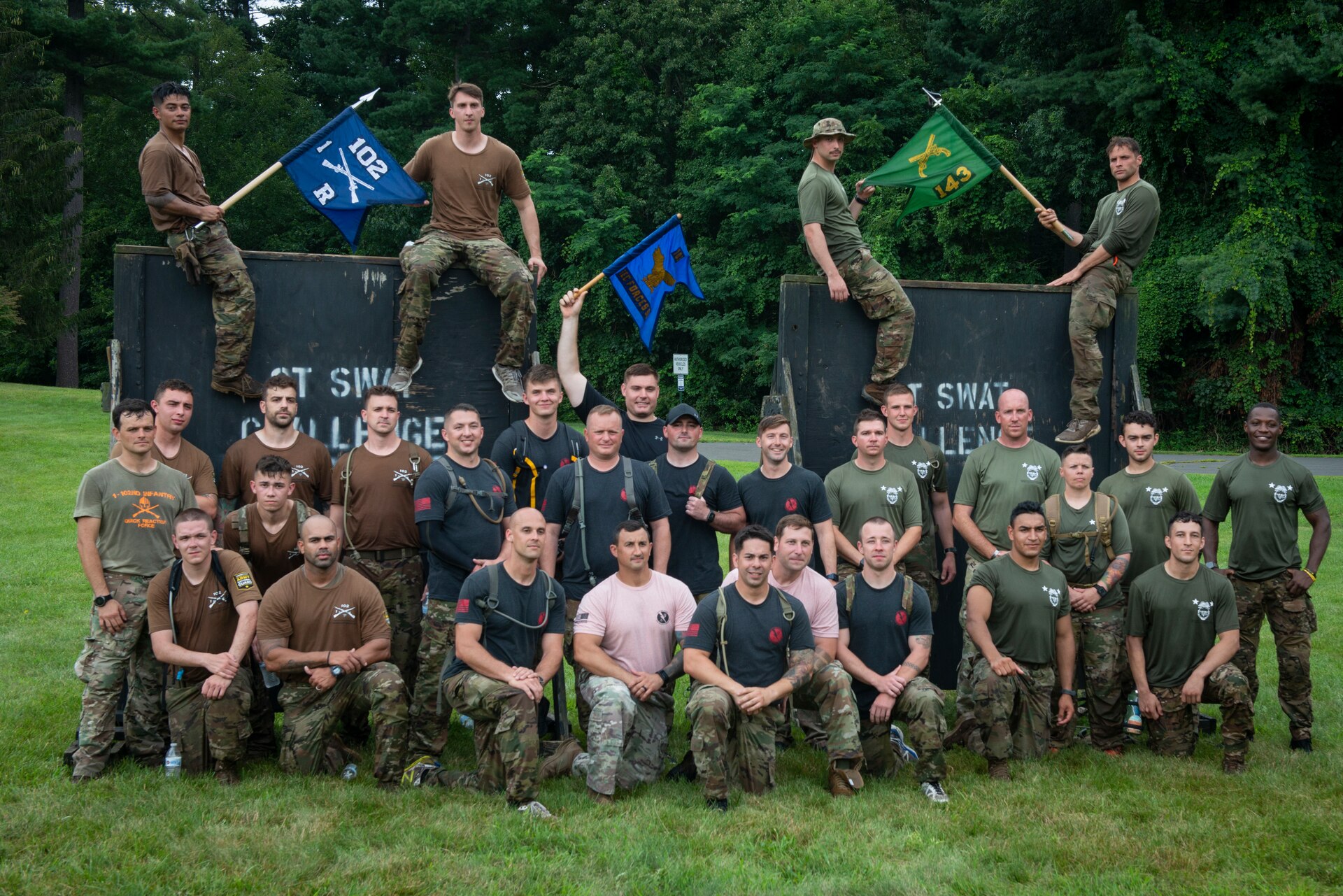 Teams from the Connecticut National Guard’s 103rd Security Forces Squadron, 1-102D Infantry Regiment (rear-detachment), and 143rd Military Police Company pose for a picture following the physical training portion of the Connecticut SWAT Challenge in West Hartford, Connecticut, Aug. 19, 2021. The competition brings together tactical operators from across the nation to train SWAT weapons tactics, movements, and physical fitness. (U.S. Air National Guard photo by Tech. Sgt. Steven Tucker)