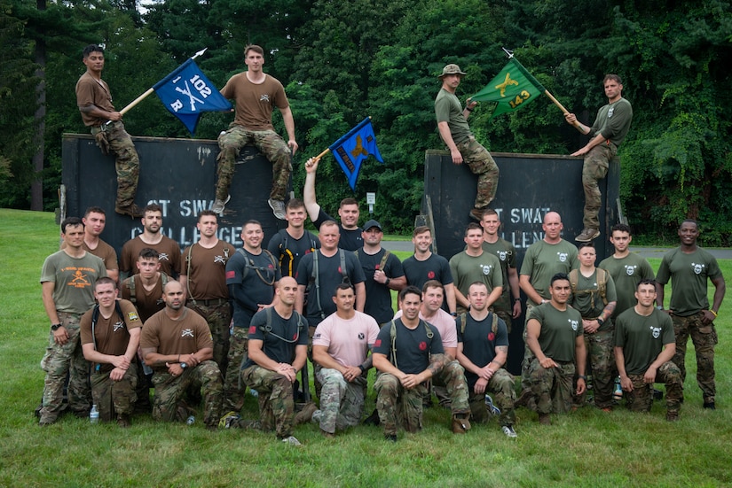 Teams from the Connecticut National Guard’s 103rd Security Forces Squadron, 1-102D Infantry Regiment (rear-detachment), and 143rd Military Police Company pose for a picture following the physical training portion of the Connecticut SWAT Challenge in West Hartford, Connecticut, Aug. 19, 2021. The competition brings together tactical operators from across the nation to train SWAT weapons tactics, movements, and physical fitness. (U.S. Air National Guard photo by Tech. Sgt. Steven Tucker)