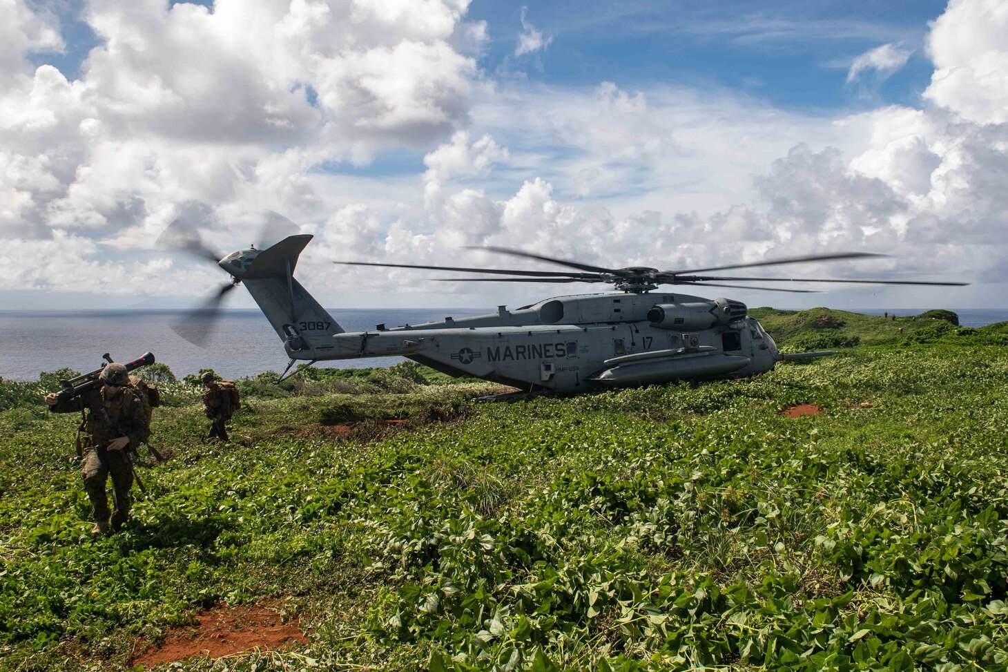 Marines assigned to the 31st Marine Expeditionary Unit (MEU), forward-deployed on the amphibious assault ship USS America (LHA 6), disembark a CH-53E Super Stallion helicopter from the 31st MEU, also forward-deployed on America, during a fire support coordination exercise. America, flagship of the America Expeditionary Strike Group, along with the 31st MEU, is operating in the U.S. 7th Fleet area of responsibility to enhance interoperability with allies and partners and serve as a ready response force to defend peace and stability in the Indo-Pacific region.