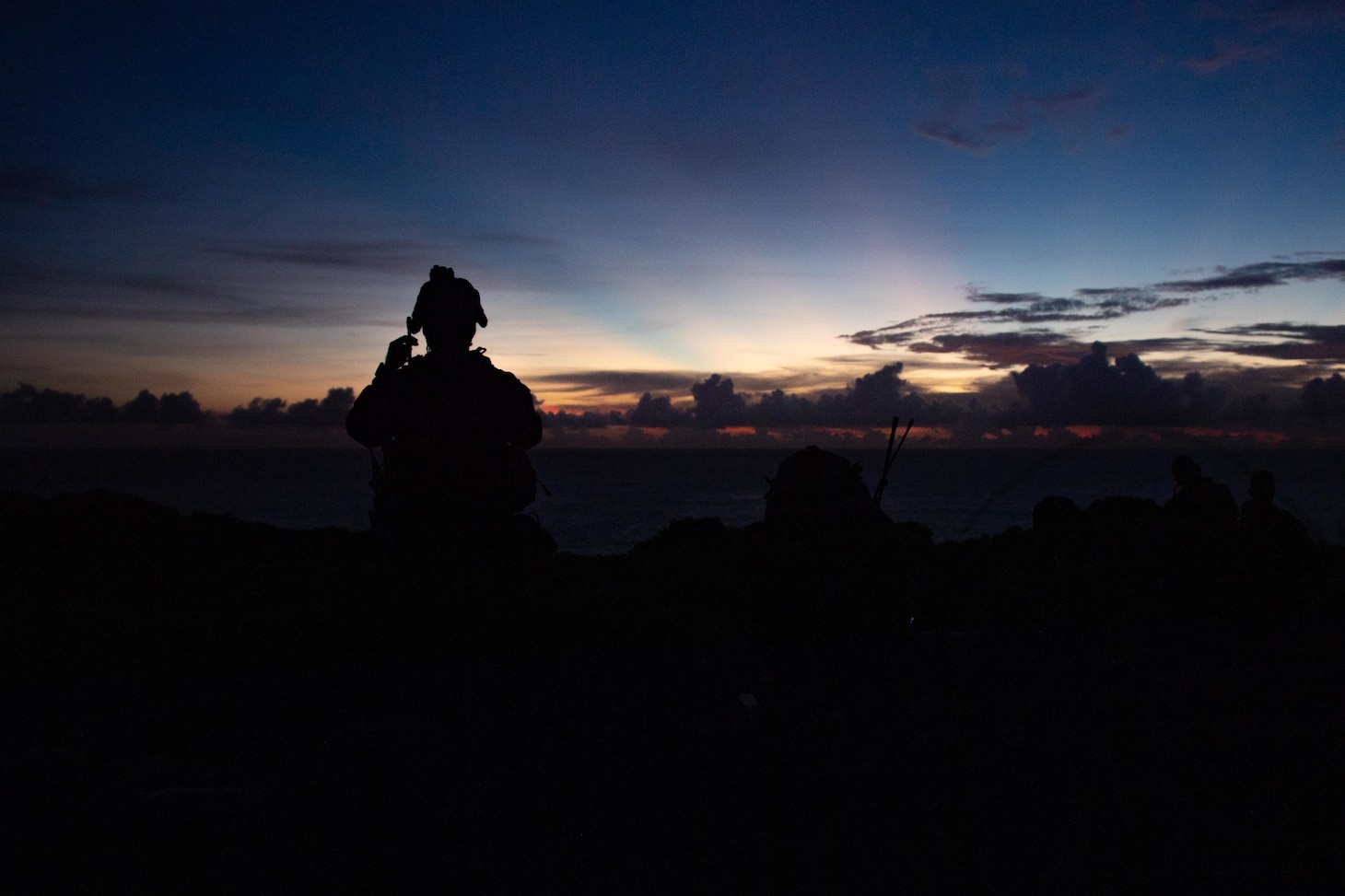 A Marine assigned to the 31st Marine Expeditionary Unit (MEU), forward-deployed on the amphibious assault ship USS America (LHA 6), dons his helmet during a fire support coordination exercise. America, flagship of the America Expeditionary Strike Group, along with the 31st MEU, is operating in the U.S. 7th Fleet area of responsibility to enhance interoperability with allies and partners and serve as a ready response force to defend peace and stability in the Indo-Pacific region.