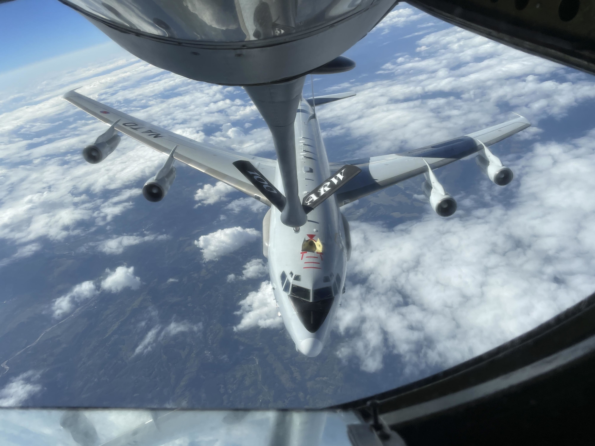 A NATO E-3 Sentry aircraft assigned to Geilenkirchen NATO Air Base, Germany, departs after receiving fuel from a U.S. Air Force KC-135 Stratotanker aircraft assigned to the 100th Air Refueling Wing, Royal Air Force Mildenhall, England, over Europe, Aug. 19, 2021. The KC-135 extends the range of fighter, bomber, transport, intelligence, reconnaissance and surveillance aircraft. (U.S. Air Force photo by Senior Airman Joseph Barron)
