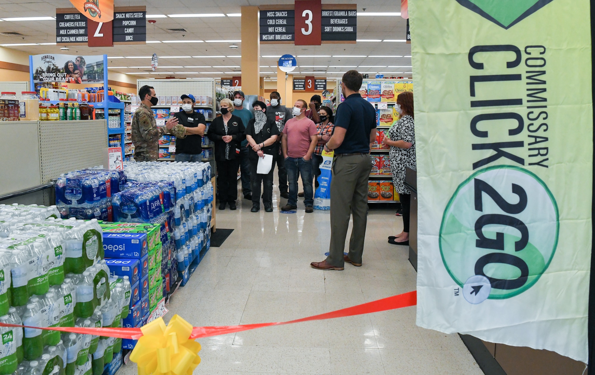 Col. Jeffrey Geraghty, left, commander of Arnold Engineering Development Complex headquartered at Arnold Air Force Base, Tenn., addresses the staff of the Arnold AFB Commissary before a ribbon cutting for the launch of the CLICK2GO online ordering and curbside pick-up service at the commissary, Aug. 3, 2021. (U.S. Air Force photo by Jill Pickett)