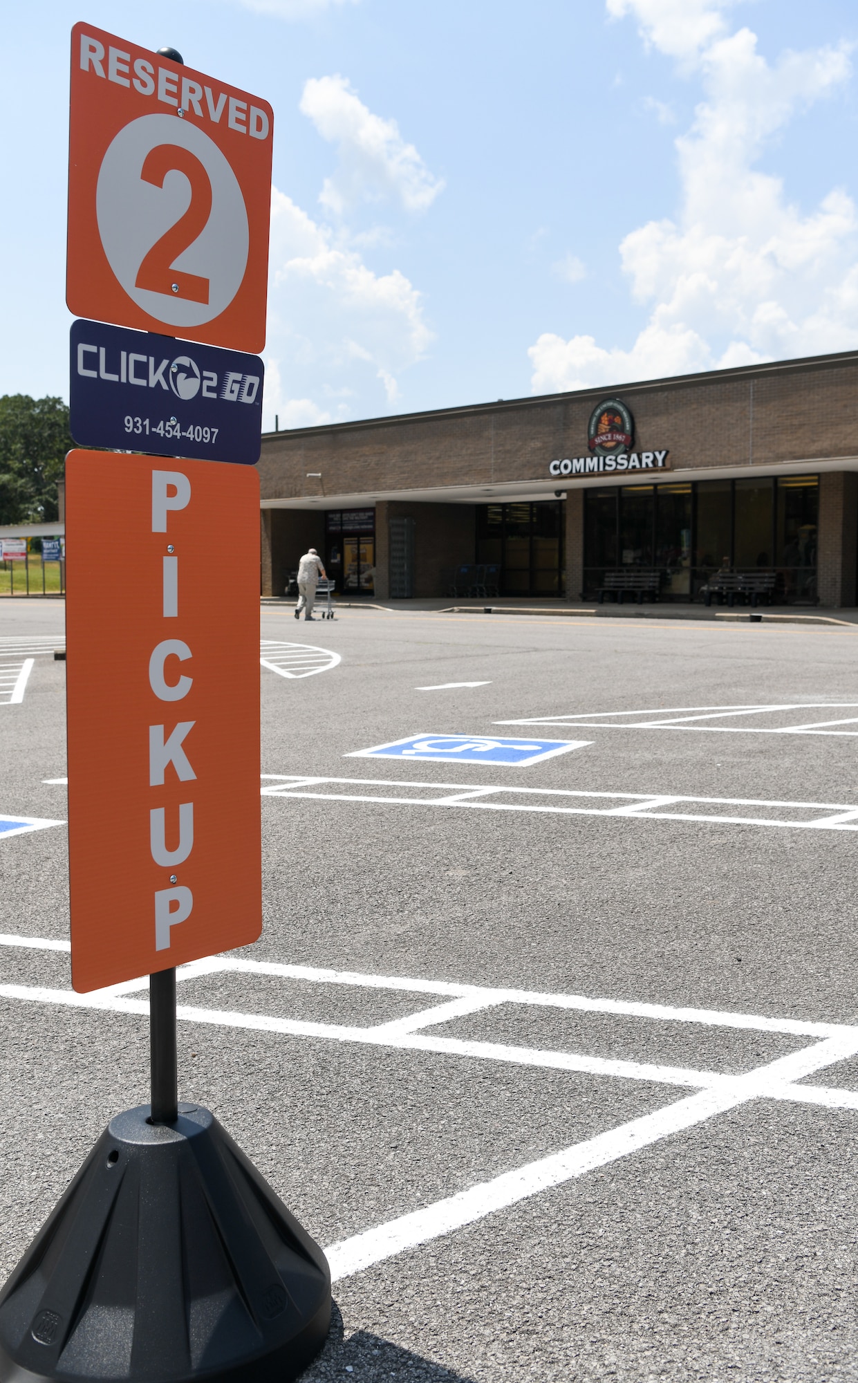 A sign informs Commissary CLICK2GO service customers where to park and what number to call to inform store employees they are ready to have their order delivered to their vehicle, Aug. 11, 2021, at Arnold Air Force Base, Tenn. (U.S. Air Force photo by Jill Pickett)