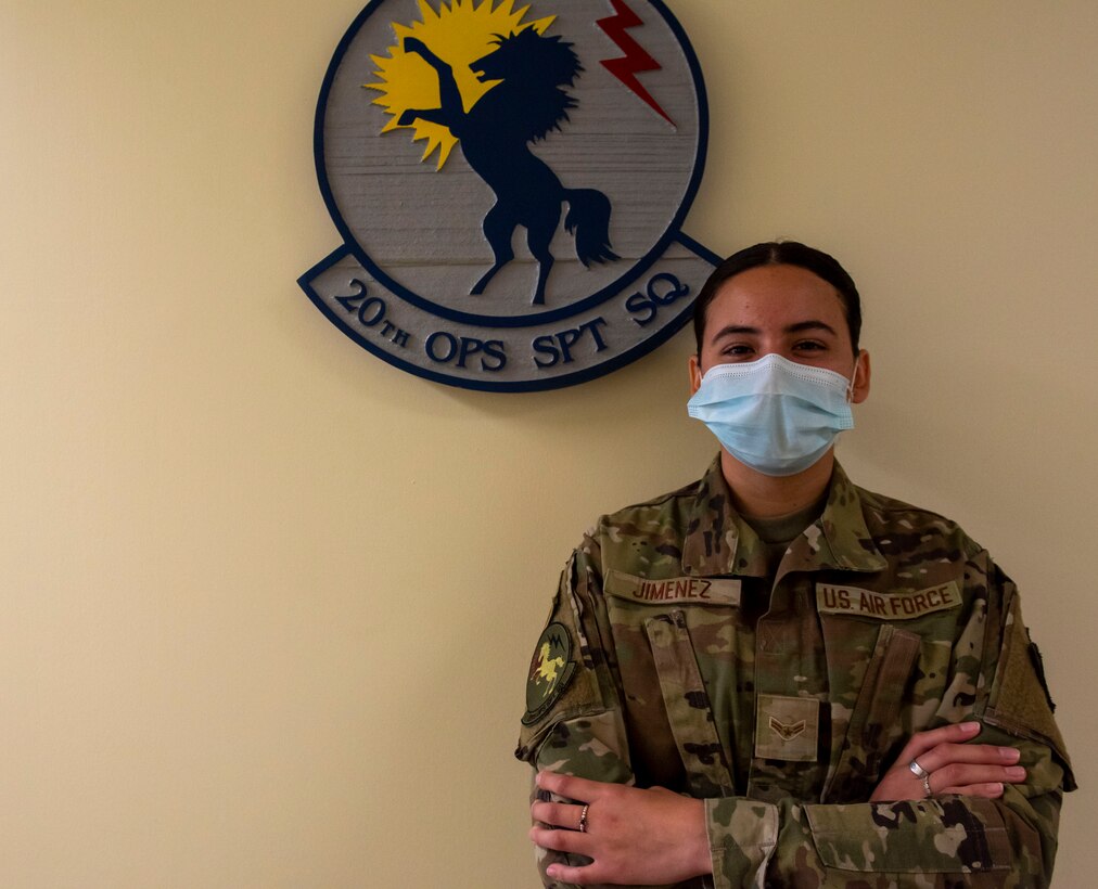 An Airman poses for a photo as part of Weasel of the Week.