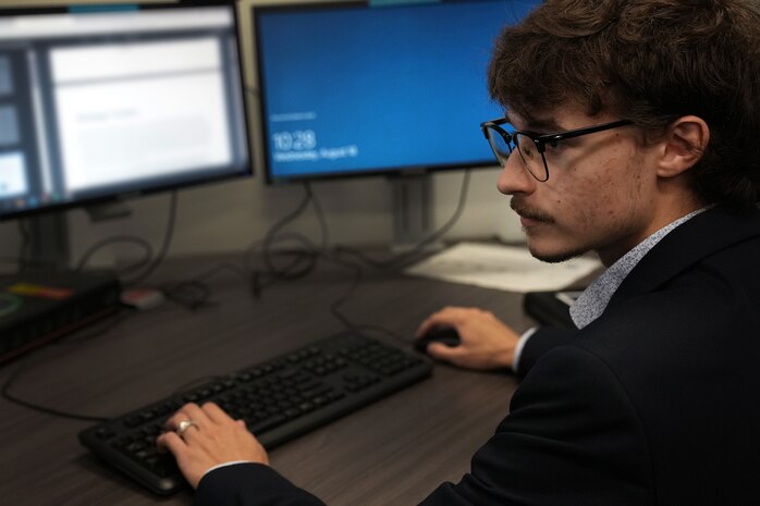 Ethan Marshall, U.S. Air Force Premier College Intern, works at U.S. Cyber Command, Fort George G. Meade, Md., Aug. 18, 2021.