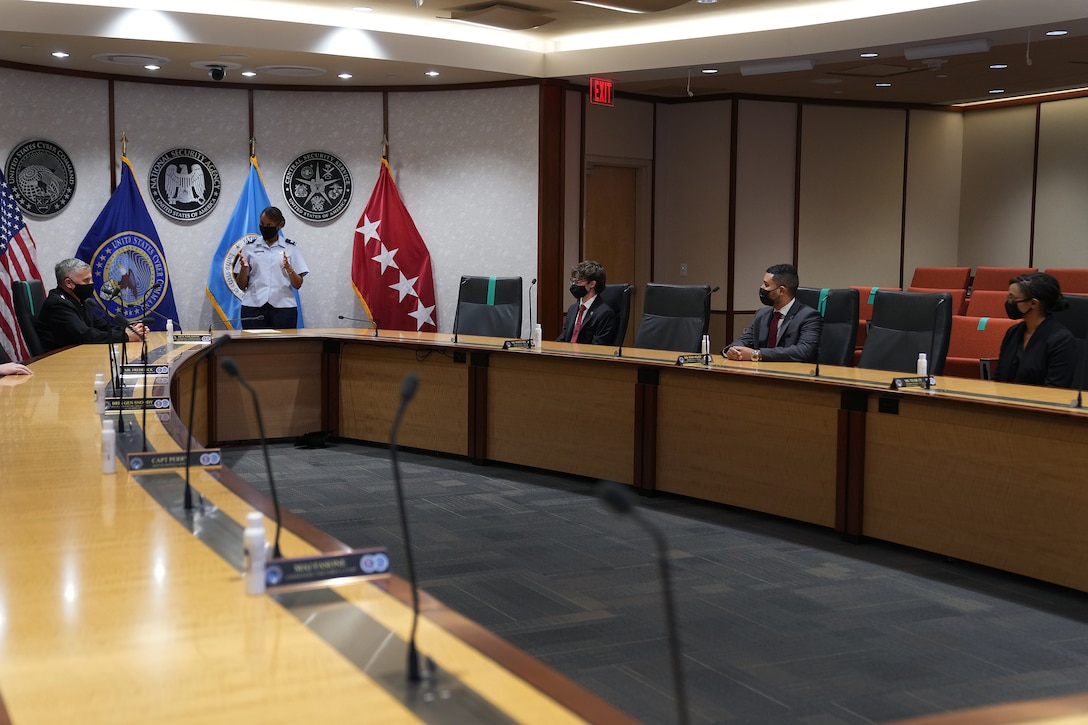 U.S. Air Force Premier College Interns, Ethan Marshall, Jimmy Rodriguez, and Aura Teasley, are recognized for their efforts while working at U.S. Cyber Command, Fort George G. Meade, Md., Aug. 18, 2021.