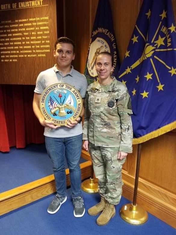 Staff Sgt. Lori Lawson poses for a photo with Huda AlDarraji along with her boyfriend Jake Hawthorne while at the Richmond Armory after Field Enlistment. Both are now contracted with EKU ROTC.