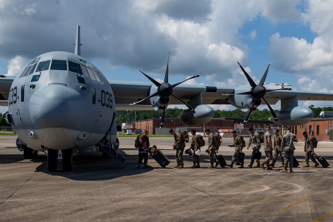 United States Marines with 2nd Marine Aircraft Wing, II Marine Expeditionary Force, board a KC-130J Hercules prior to deploying to Haiti in support of Joint Task Force-Haiti for a humanitarian-assistance and disaster-relief mission from Marine Corps Air Station Cherry Point, North Carolina, Aug. 23, 2021. (U.S. Marine Corps photo by Lance Cpl. Elias E. Pimentel III)