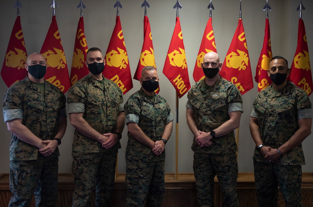 U.S. Marine Sgt. Maj. Troy E. Black, the Sergeant Major of the Marine Corps, recognizes Marines of 8th Marine Corps Recruiting District on Naval Air Station Joint Reserve Base, Fort Worth, Texas, May 6, 2021. Black gives challenge coins to the recognized Marines. (U.S. Marine Corps photo by Lance Cpl. Hannah Hollerud)