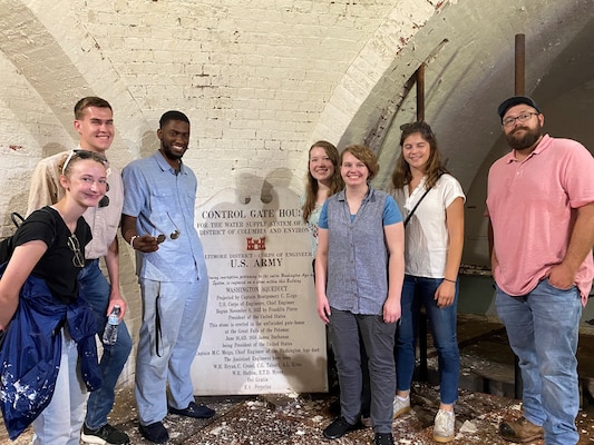 Six U.S. Army Corps of Engineers Transatlantic Middle East District (TAM) summer hires and one Department of the Army fellow stop for a photo during a tour of the Washington Aqueduct. Since TAM's mission is primarily overseas, the team toured the aqueduct to show them another aspect of the USACE mission.