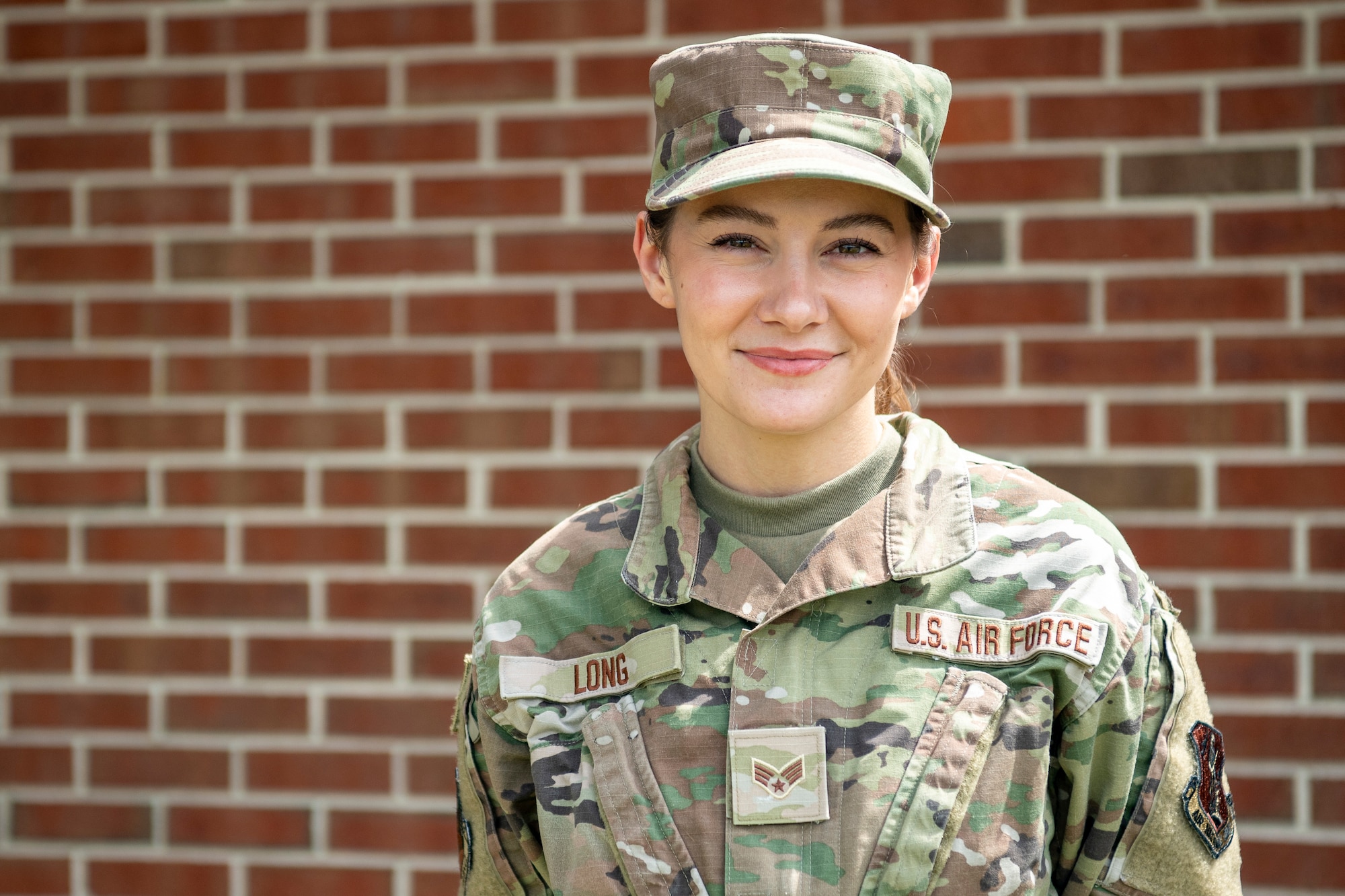 Senior Airman Shenandoah Long, 192nd Wing command support staff, poses for a photo outside the wing headquarters building Aug. 8, 2021, at Joint Base Langley-Eustis, Virginia.