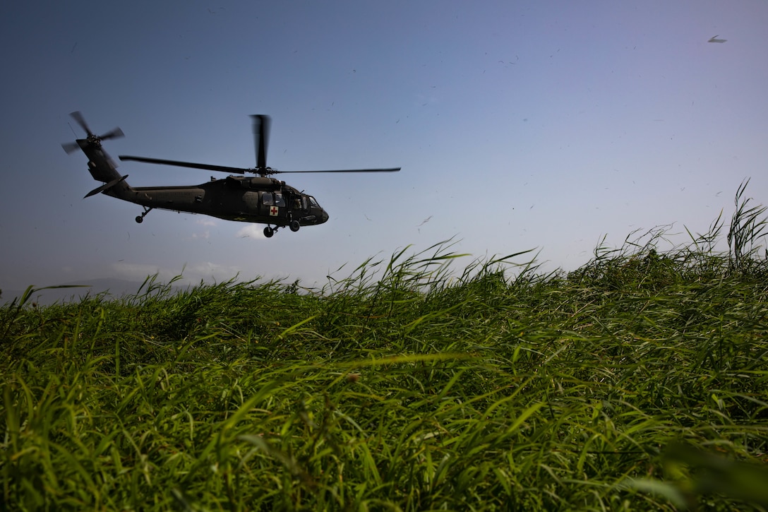 A UH-60 helicopter from the Puerto Rico Army National Guard Aviation departs Port-au-Prince Airport, Haiti, Aug. 24, 2021.