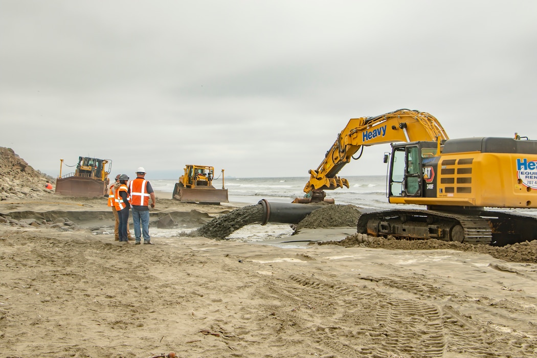 Sand, beach, ocean and construction equipment