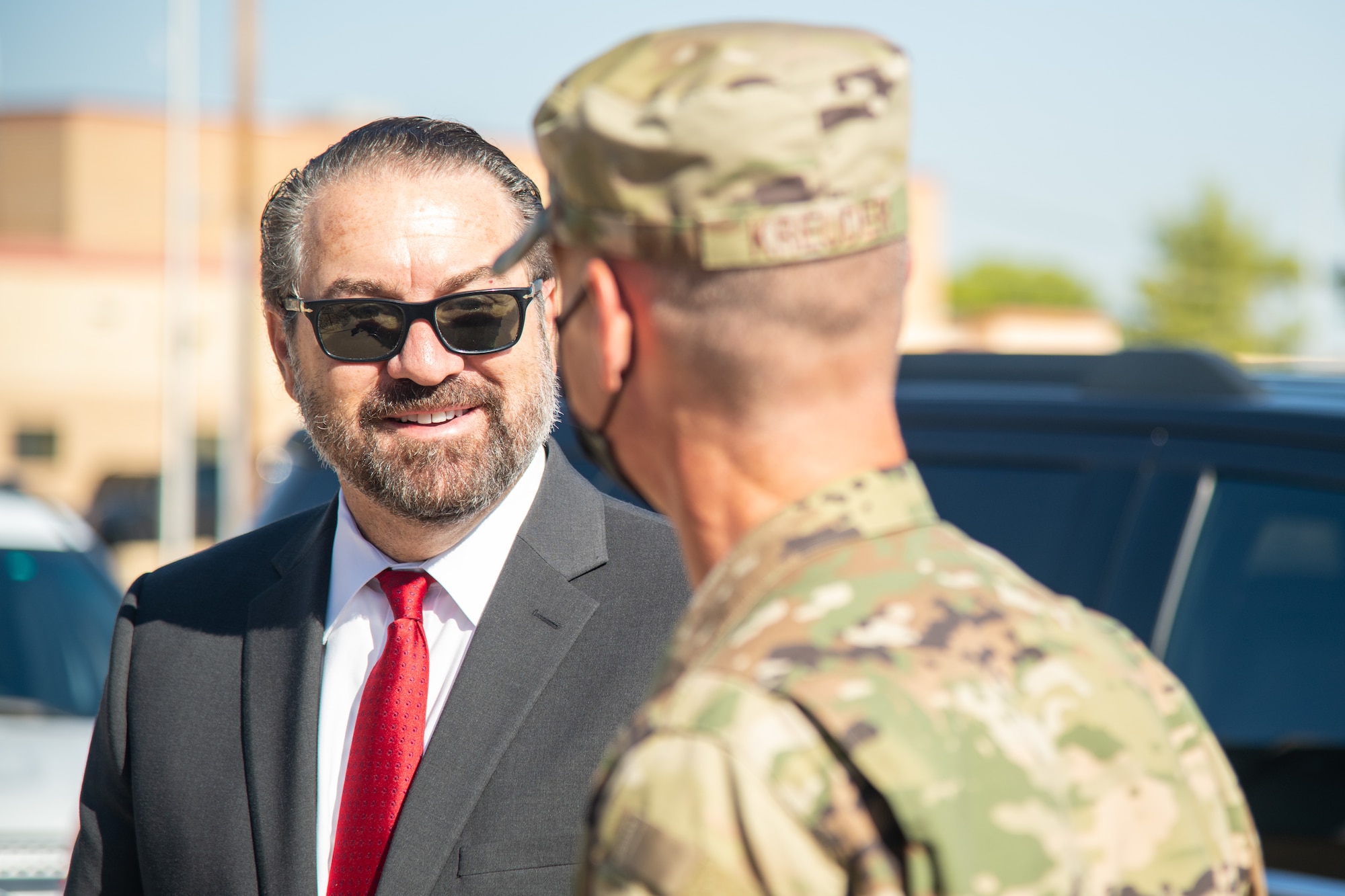 Brig. Gen. Gregory Kreuder, right, 56th Fighter Wing commander, greets Mark Brnovich, left, Arizona Attorney General, Aug. 20, 2021, at Luke Air Force Base, Arizona. Brnovich’s visit included a wing mission brief, an Academic Training Center tour and an F-35A Lightning II virtual demonstration conducted by pilots with the 62nd Fighter Squadron. Brnovich toured the base and met with wing leadership to observe Luke’s mission of training the world’s greatest fighter pilots and combat-ready Airmen. (U.S. Air Force photo by Staff Sgt. Collette Brooks)