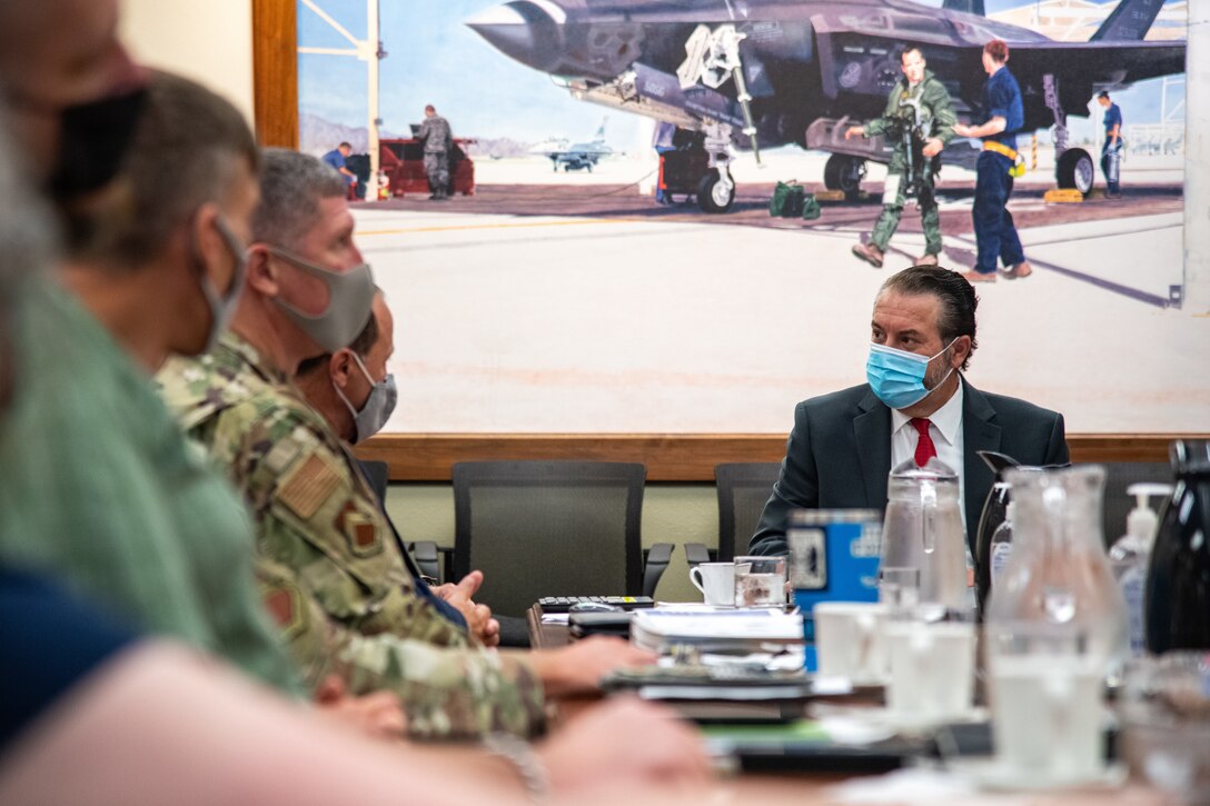 Mark Brnovich, right, Arizona Attorney General, engages with 56th Fighter Wing leadership during a wing mission brief Aug. 20, 2021, at Luke Air Force Base, Arizona. During the brief, leadership discussed various topics such as Luke AFB history, family support agencies and the overall base mission. Brnovich toured the base and met with wing leadership to observe Luke’s mission of training the world’s greatest fighter pilots and combat-ready Airmen. (U.S. Air Force photo by Staff Sgt. Collette Brooks)