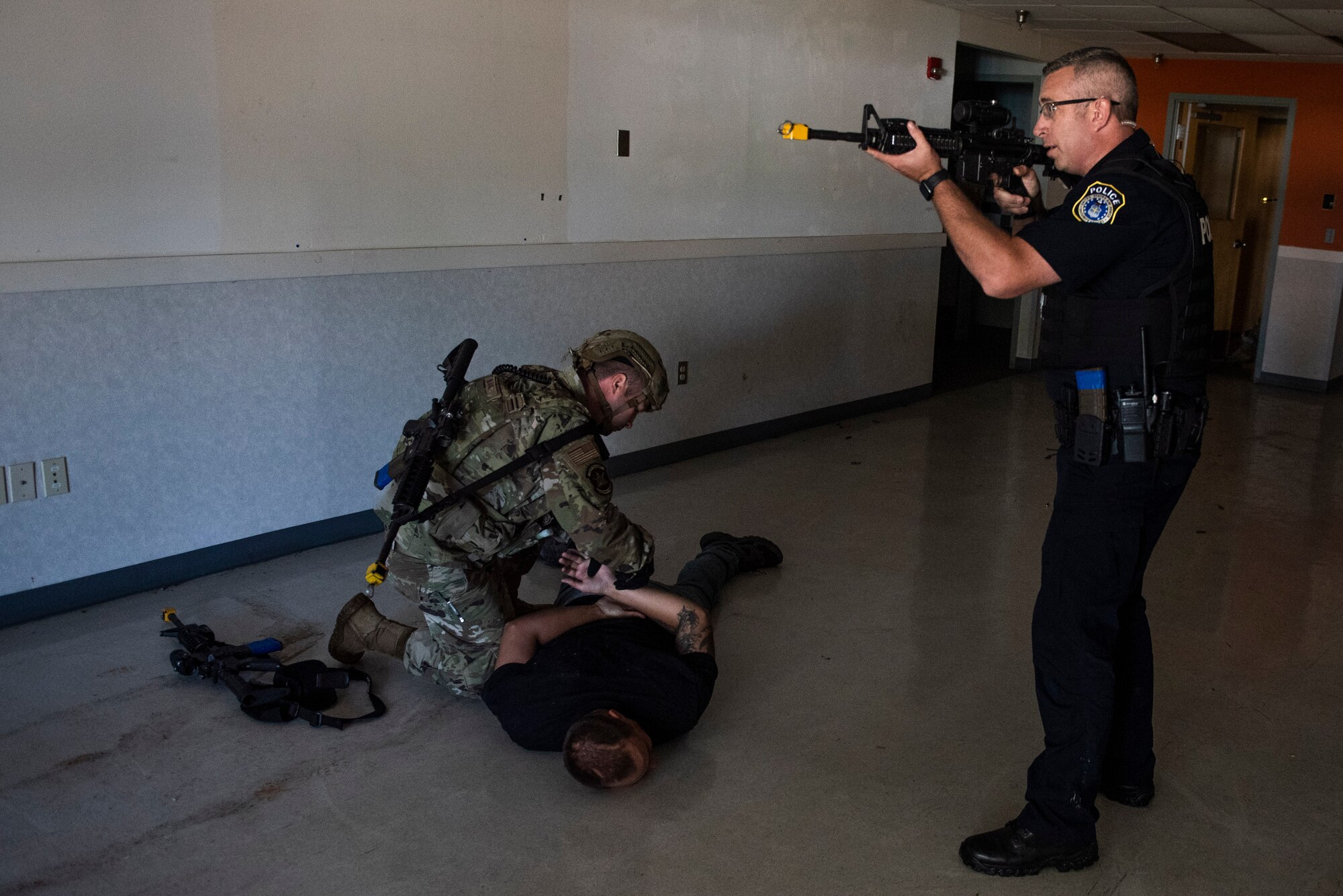 Members of the 88th Security Forces Squadron take down the “active shooter” after locating and eliminating the threat during an exercise, Aug. 18 at Wright-Patterson Air Force Base. (U.S. Air Force photo by Wesley Farnsworth)