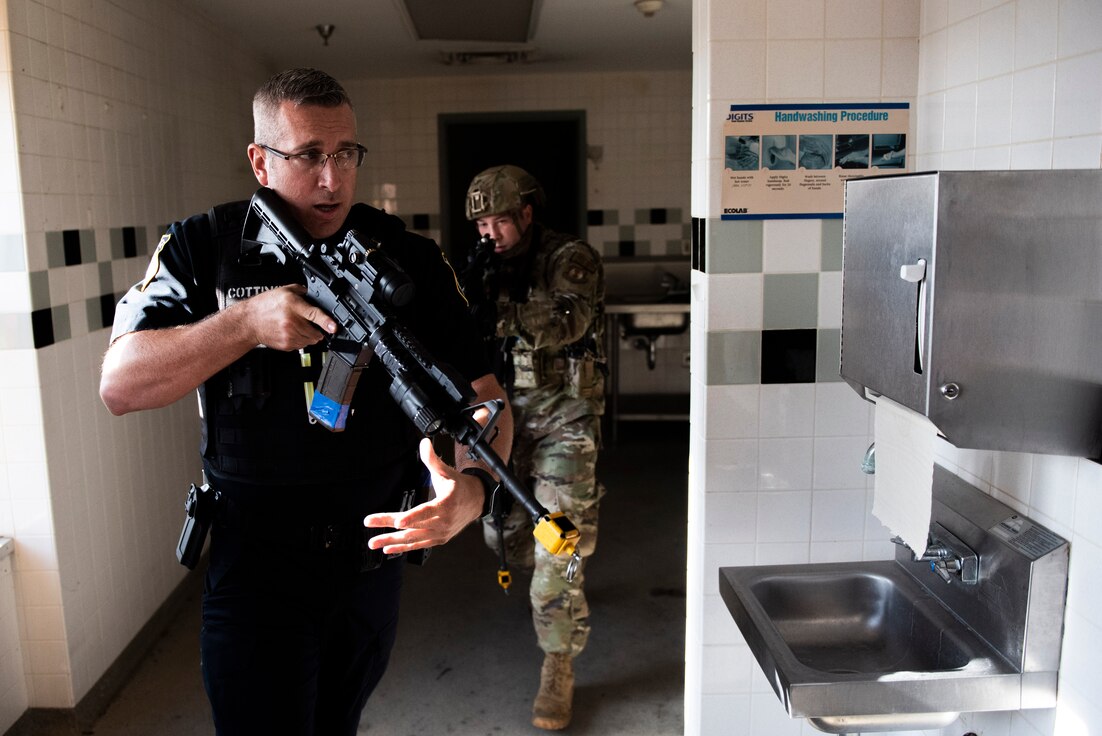 Members of the 88th Security Forces Squadron work to clear a building during an active shooter exercise, Aug. 18 at Wright-Patterson Air Force Base. (U.S. Air Force photo by Wesley Farnsworth)