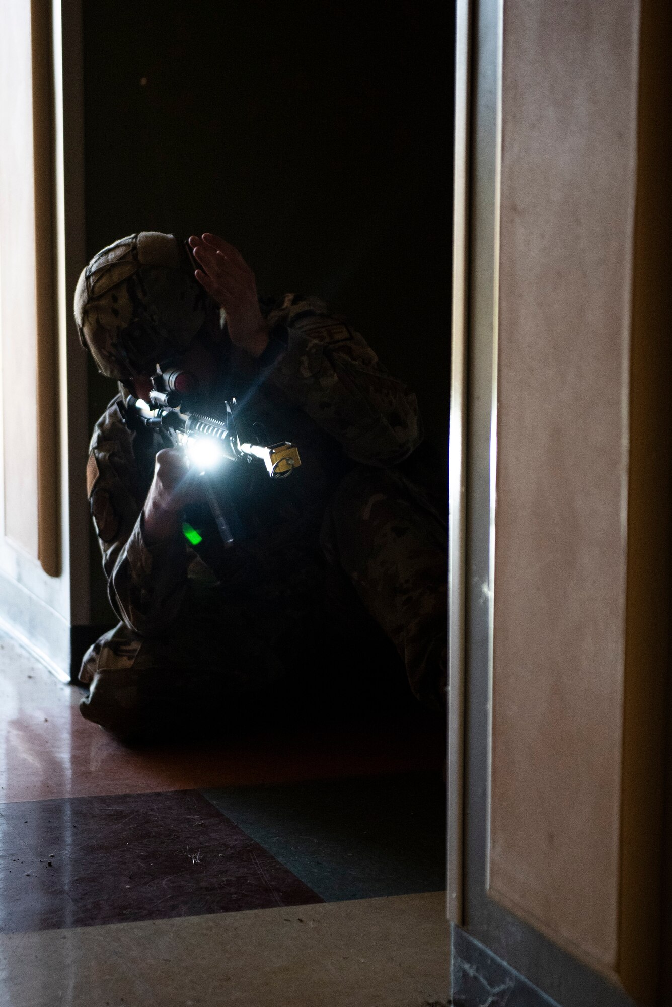 An 88th Security Forces Squadron secures one end of a cleared hallway during an active-shooter exercise, Aug. 18 at Wright-Patterson Air Force Base, Ohio. Readiness exercises are routinely held to streamline unit cohesion when responding to emergencies. (U.S. Air Force photo by Wesley Farnsworth)