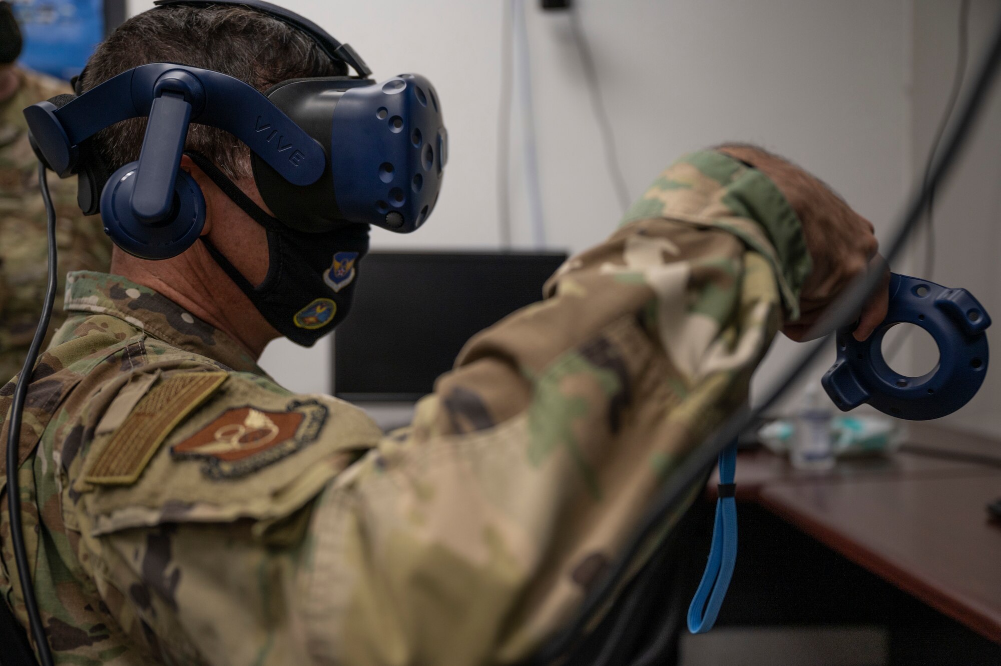 Maj. Gen. Andrew Gebara, 8th Air Force and Joint-Global Strike Operations Center commander, tests a virtual reality training headset at Dyess Air Force Base, Texas, Aug. 23, 2021. Gebara participated in an engine test cell virtual reality fire training scenario. (U.S. Air Force photo by Senior Airman Colin Hollowell)