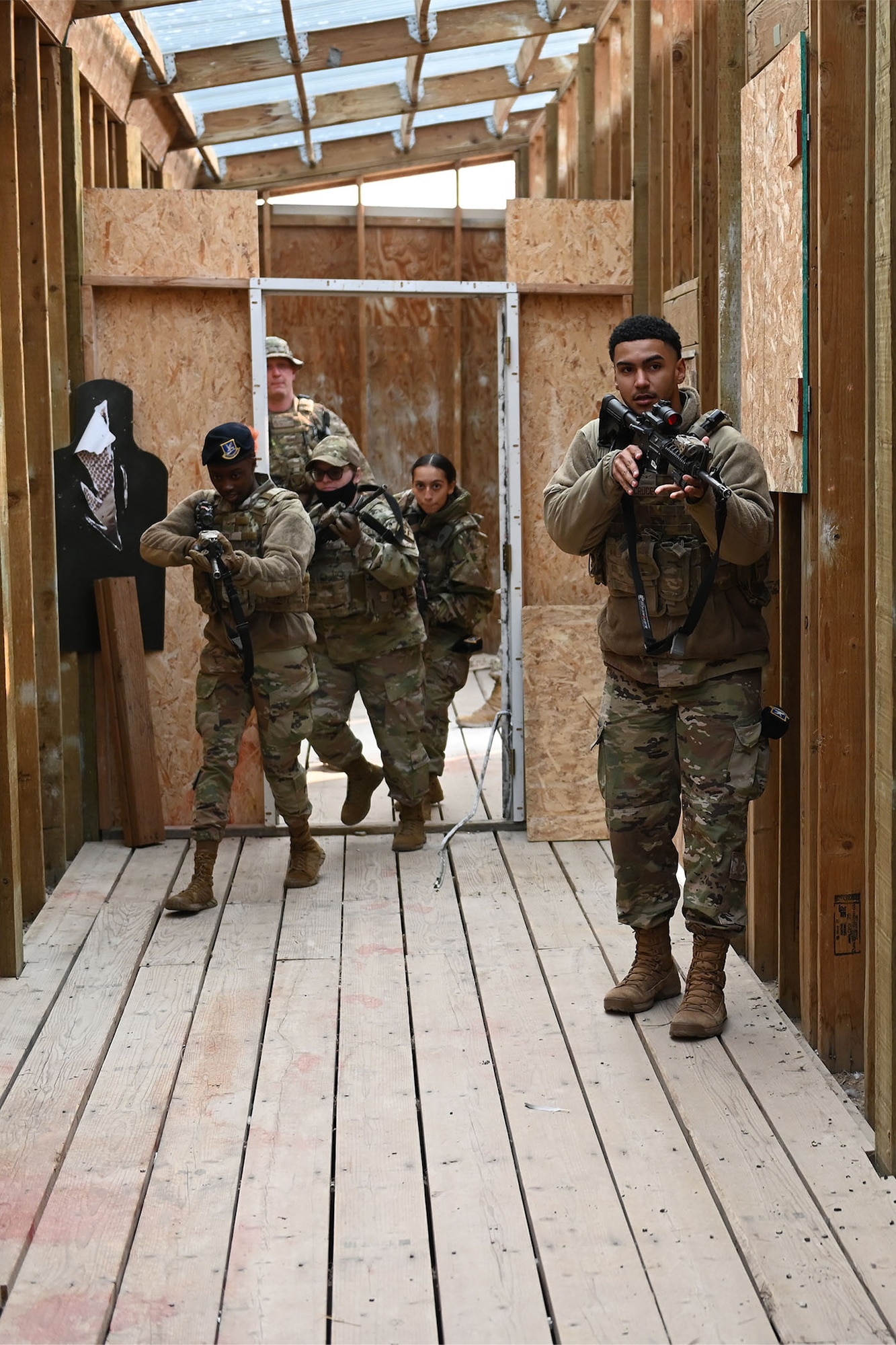 Defenders from the 841st Missile Security Forces Squadron practice breaching techniques during an exercise Aug. 17, 2021, at Fort Harrison, Mont. The defenders practiced staying in formation, verbalizing commands and reclaiming the building from potential threats. (U.S. Air Force photo by Airman Elijah Van Zandt)