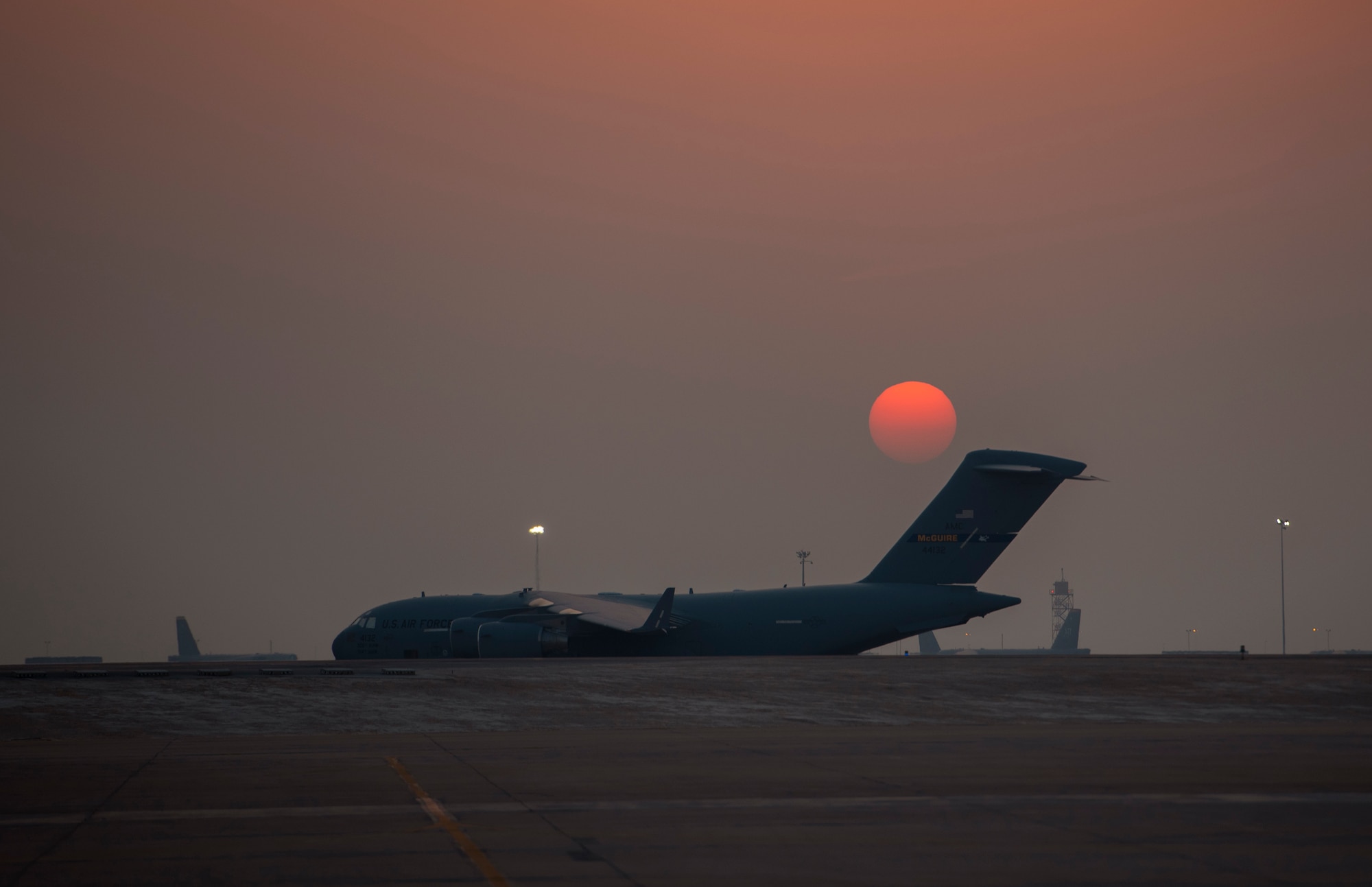A C-17 Globemaster lll is parked on the flightline Aug. 23, 2021, at Al Udeid Air Base, Qatar.