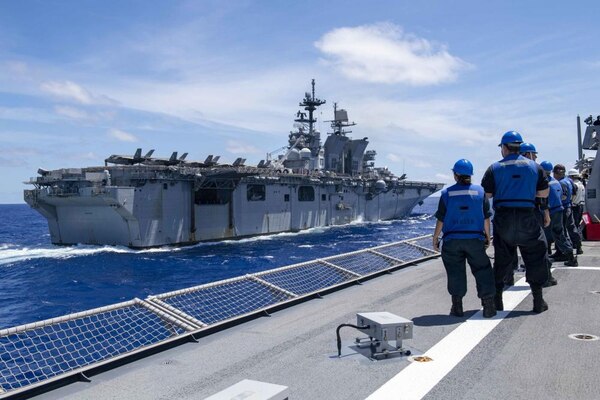 Fueling At Sea between USS Charleston (LCS 18) and USS America (LHA 6)