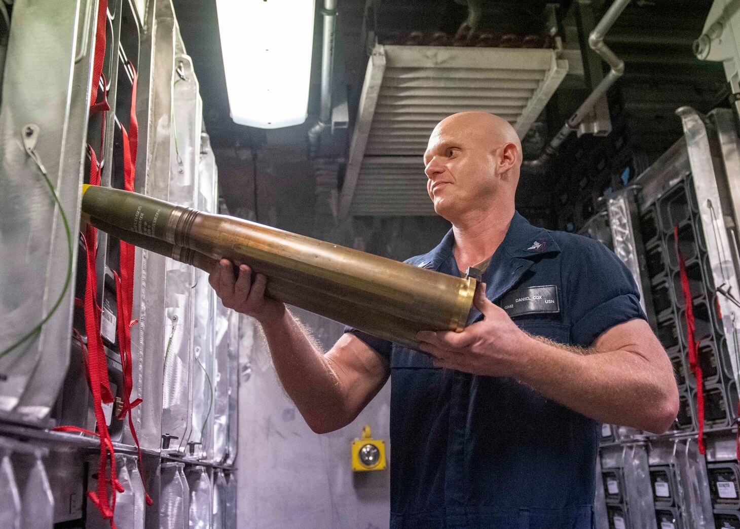 Gunner's Mate 2nd Class Daniel Cox, from Leavenworth, Kan., stows 57mm rounds aboard Independence-variant littoral combat ship USS Charleston (LCS 18), Aug. 18.