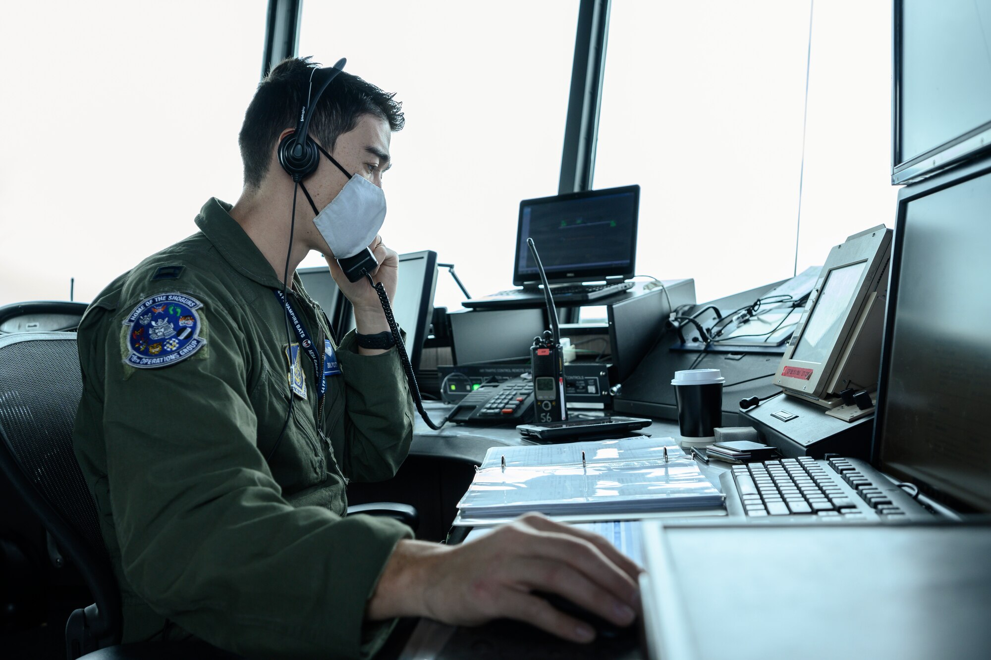 U.S. Air Force Capt. Daniel Pickett, 44th Fighter Squadron F-15C instructor pilot stationed at Kadena Air Base, Japan, answers a phone call Aug. 19, 2021, at Eielson Air Force Base, Alaska. Pickett was among the Airmen brought in from across the U.S. military to train at Eielson AFB during Red Flag 21-3, held Aug. 12 – 27. (U.S. Air Force photo by Staff Sgt. Christian Conrad)