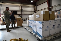 Airmen from the 151st Logistics Readiness Squadron palletize medical equipment and supplies Aug 25, 2021, at Roland Wright Airbase in Salt Lake City, Utah